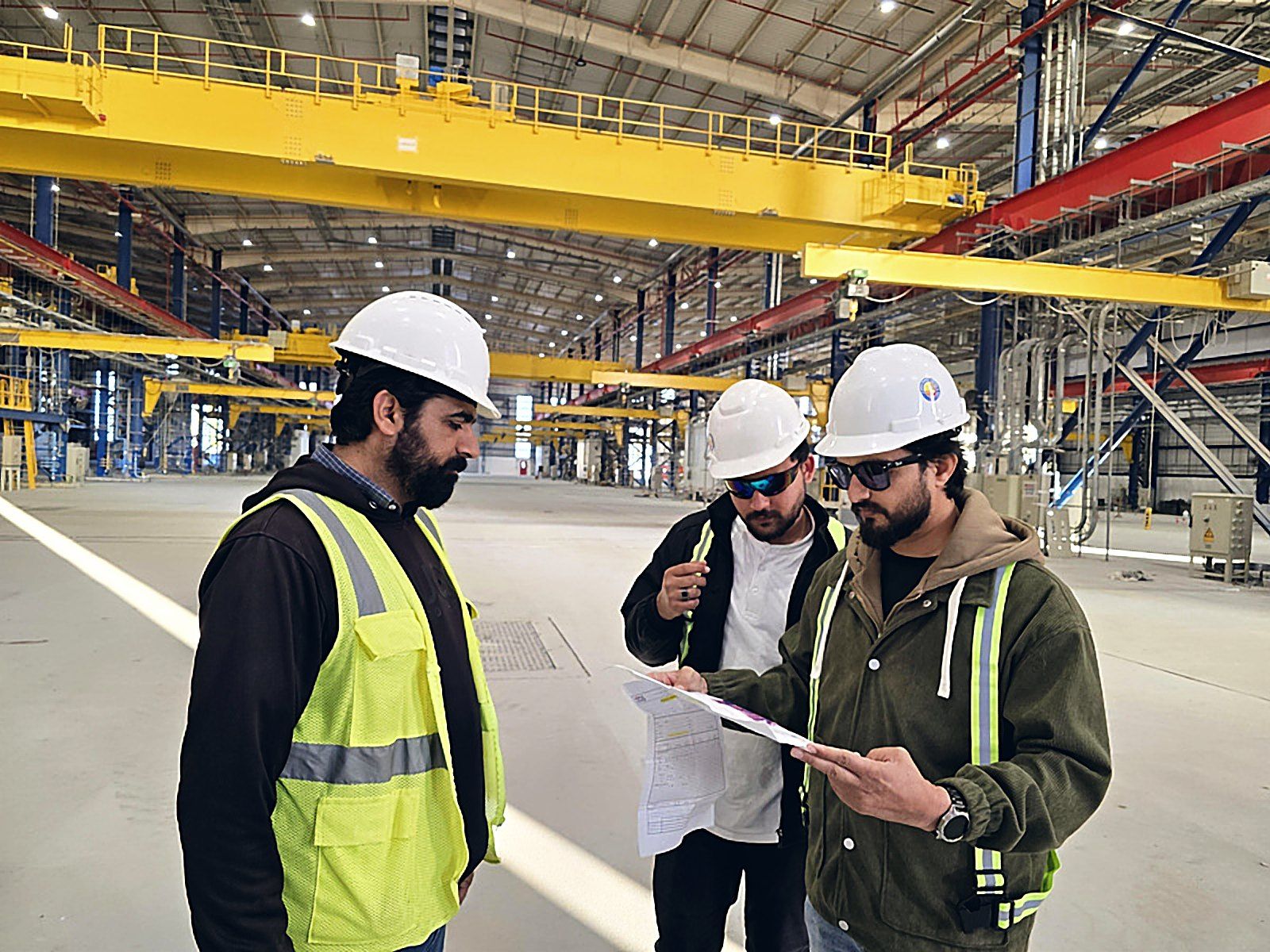 UEC inspectors reviewing drawings on site
